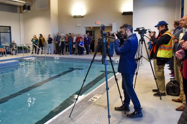 Residents and staff at indoor pool event