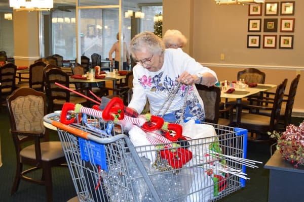 Resident preparing decorations in a dining area