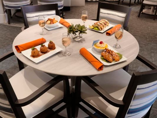 Elegant dining table with gourmet meals and drinks