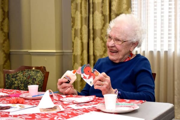 Resident enjoying an arts and crafts activity in a common area