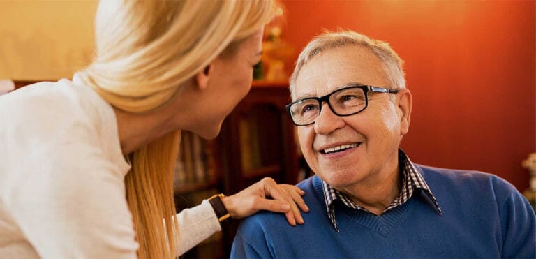 A caregiver conversing with an elderly resident