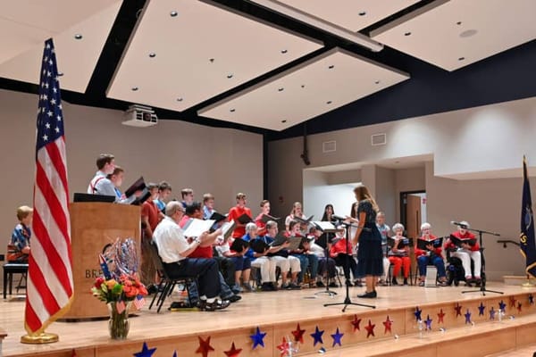 Residents and staff participating in a choir performance