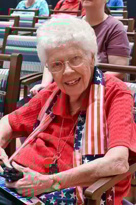 Senior woman smiling in a community activity room
