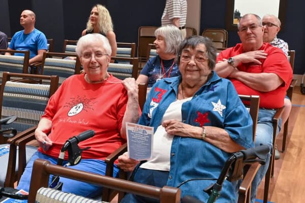 Two residents smiling during an activity session