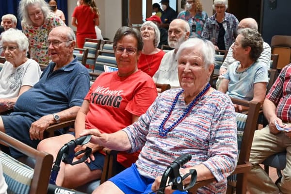 Residents and staff enjoying an engaging activity indoors