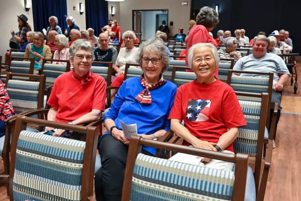 Residents enjoying an event in a common area