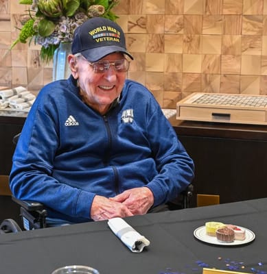 Resident enjoying dessert at a celebration event