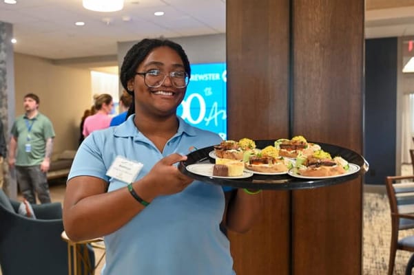 Staff member serving delicious treats in the facility