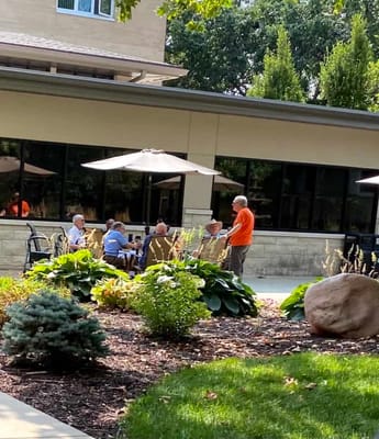 Residents enjoying time outdoors in a garden area
