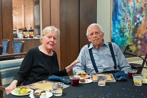 Residents enjoying a meal together in the dining room