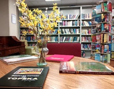 Cozy library corner with books and floral decor