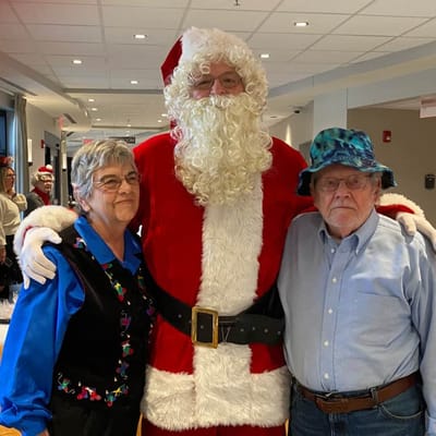 Residents celebrating with Santa in a festive common area