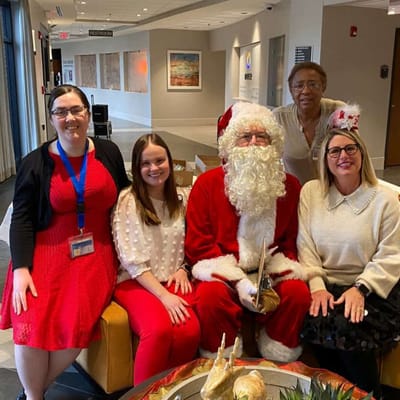 Staff and Santa celebrating with residents