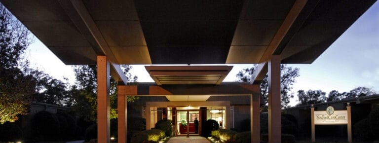 Entrance of a senior living facility with a covered portico