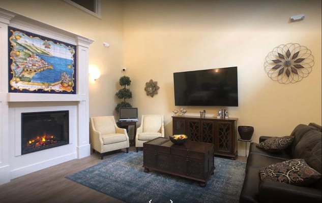 Cozy common area with seating and a fireplace