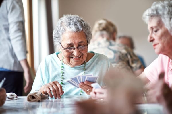 Residents engaged in a friendly card game