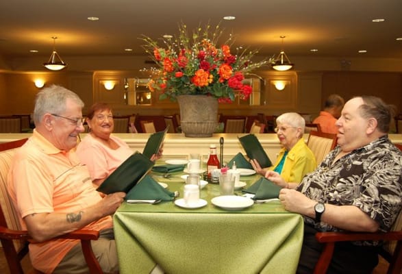 Residents enjoying a meal in the dining room