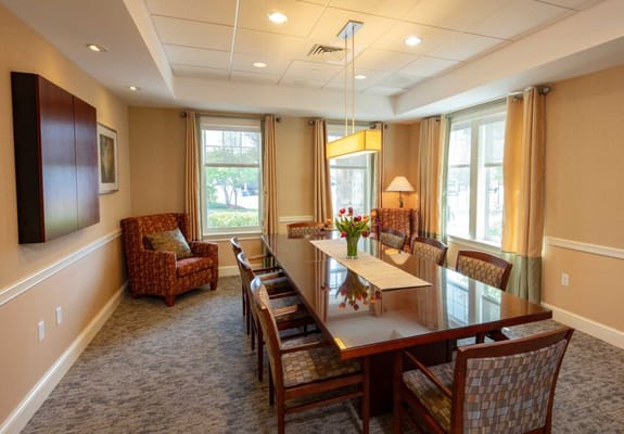 Bright dining room with a large table and chairs