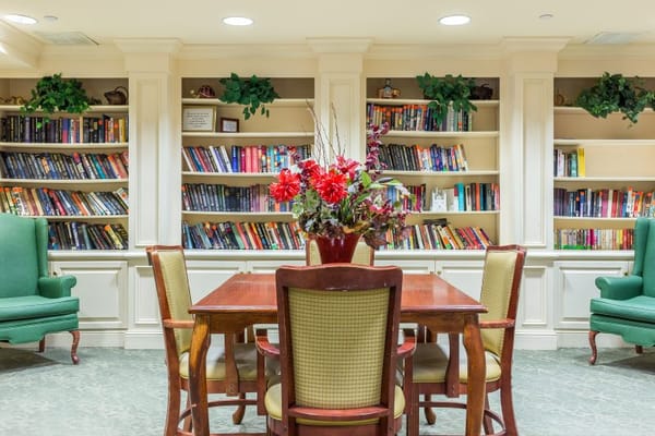 Common area with bookshelves and table set up
