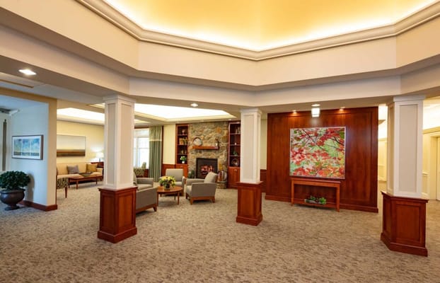 Bright interior common area with seating and artwork
