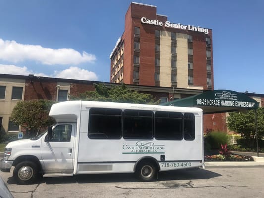 Facility transport van parked outside the building