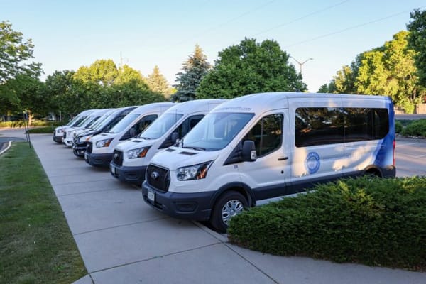 Facility transport vans parked outside