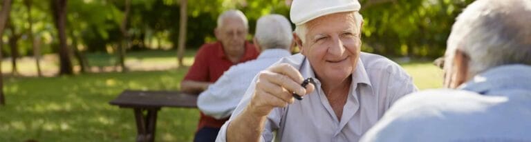 Seniors enjoying conversation in a garden setting