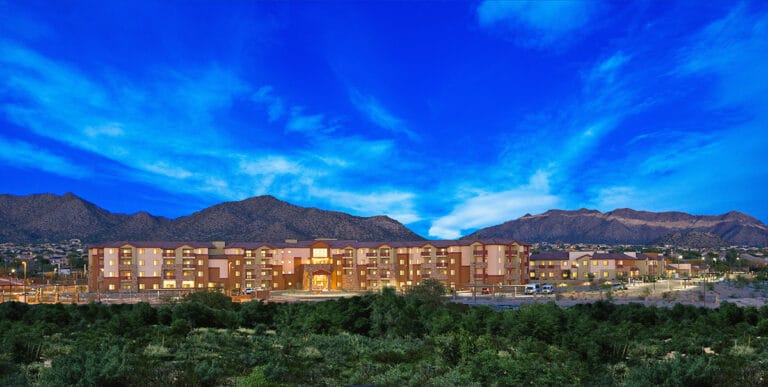 Exterior view of assisted living facility at dusk