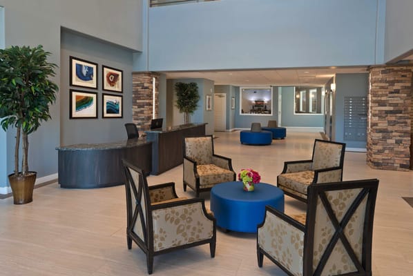 Bright lobby area with seating and artwork