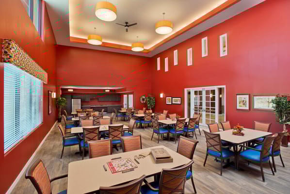 Bright dining room with tables and chairs