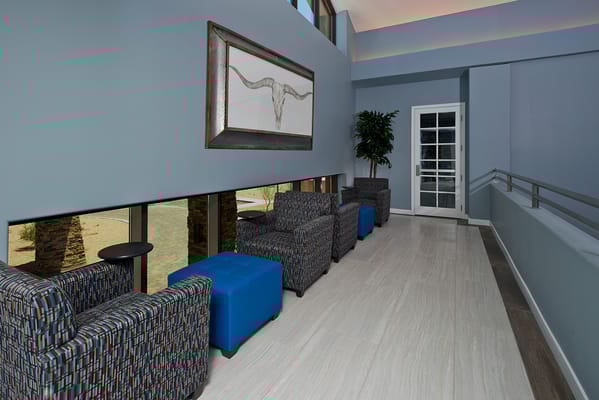 Bright common area with seating and artwork