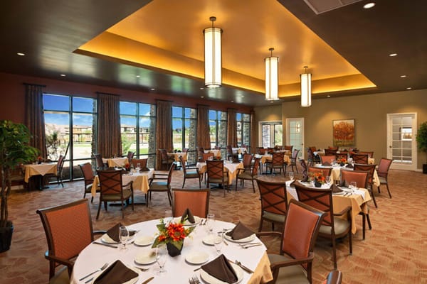 Tastefully set dining room with large windows