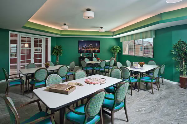 Bright common area with tables and chairs