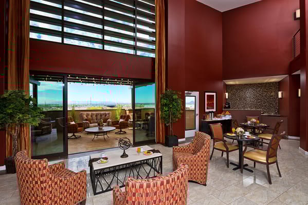 Bright common area with seating and outdoor view