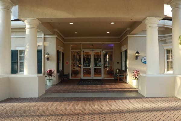 Entrance to a senior living facility with a welcoming atmosphere