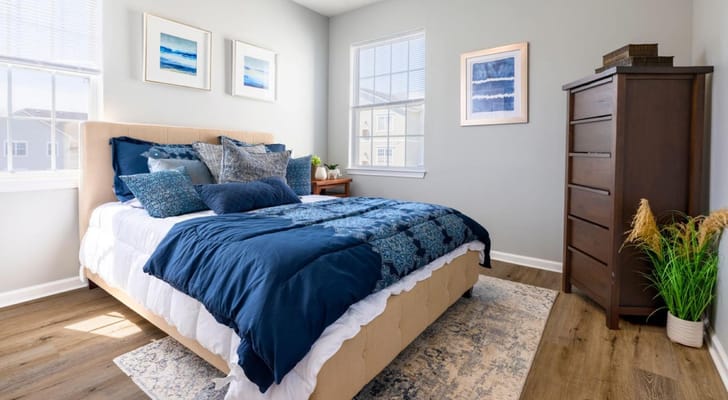 Cozy bedroom with blue accents and natural light
