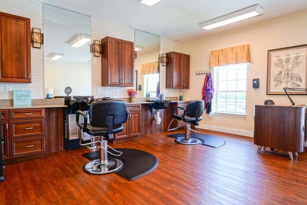 Interior view of a hair salon with styling stations
