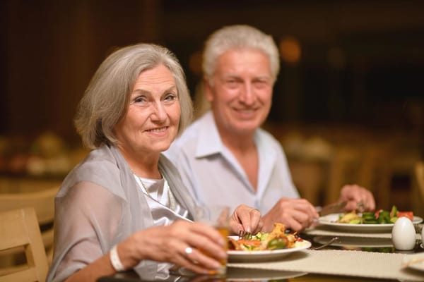Couple enjoying a meal in a dining setting