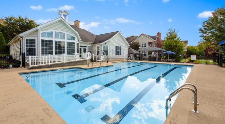 Outdoor pool area with a view of the facility exterior