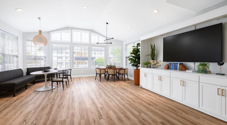 Bright common area with seating and dining table
