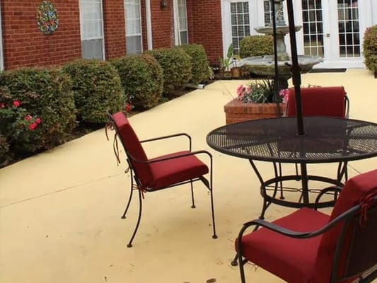 Outdoor patio area with seating and landscaping