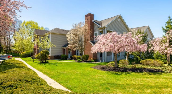 Exterior view of the assisted living facility with blooming trees