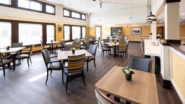 Bright dining area with tables and chairs