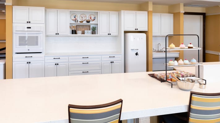 Bright kitchen interior with desserts displayed