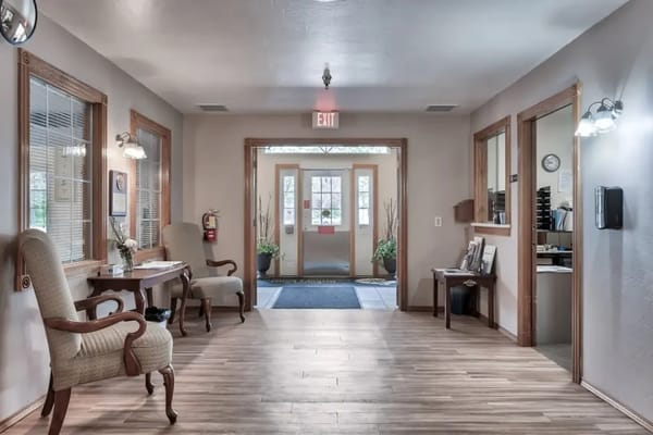Bright hallway with natural light and comfortable seating