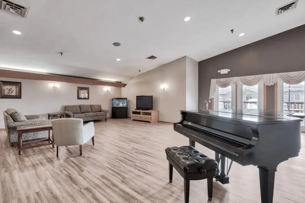 Interior common area with seating and a piano