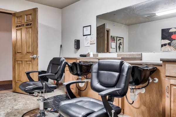 Interior view of a beauty shop with salon chairs