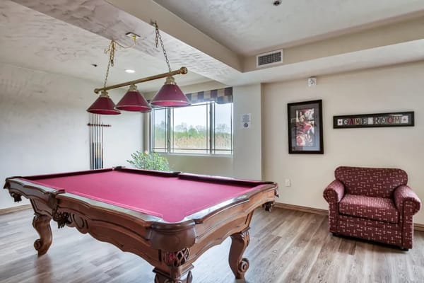 Common area with a pool table and seating
