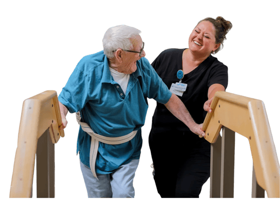 Staff assisting a resident during therapy