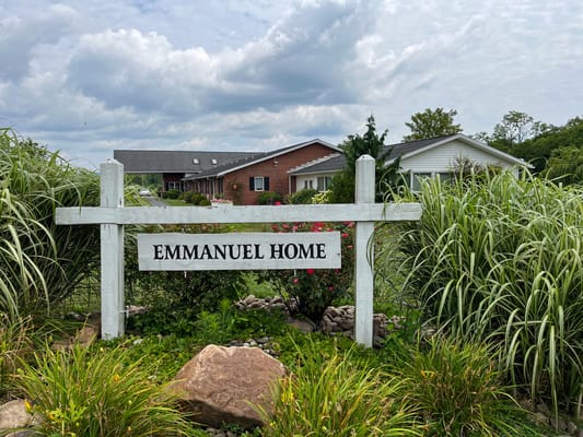 Exterior photo of Emmanuel Home with landscaping